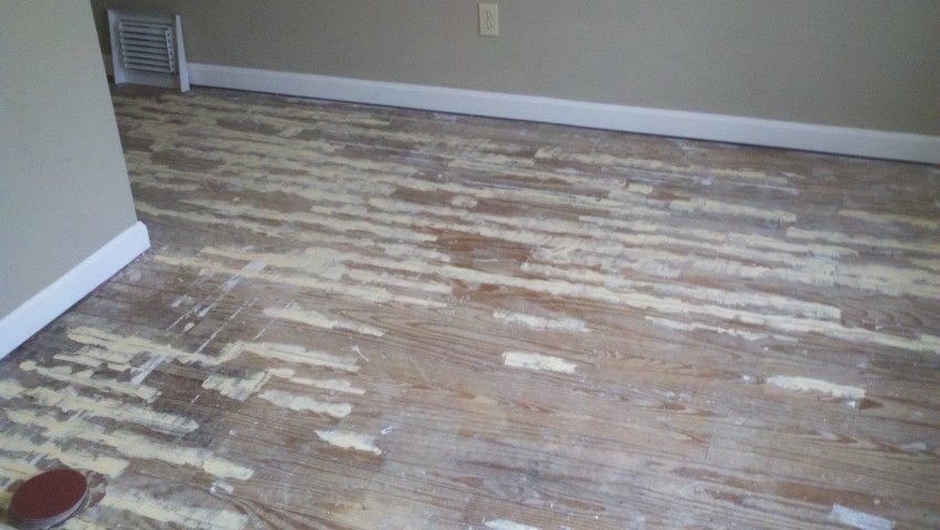 a really damaged and scratched up wood floor