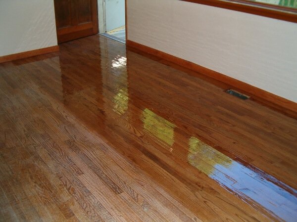 A photo showing the effectiveness of our Columbia based hardwood floor resurfacing service